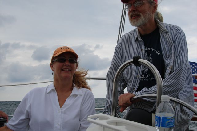 Mary, with husband Bill at the helm