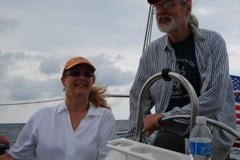 Mary, with
                  husband Bill at the helm